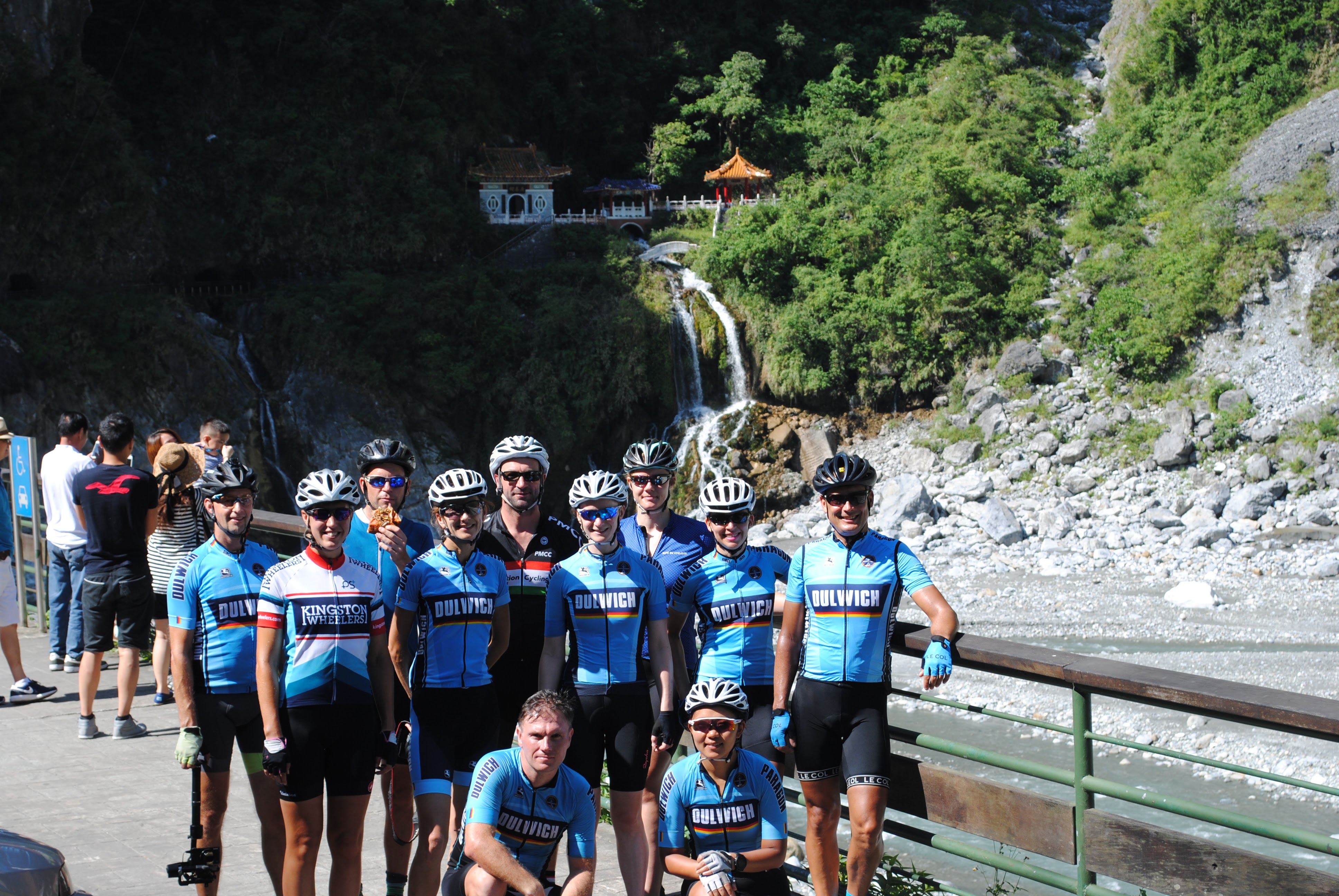 Group at riverside waterfall