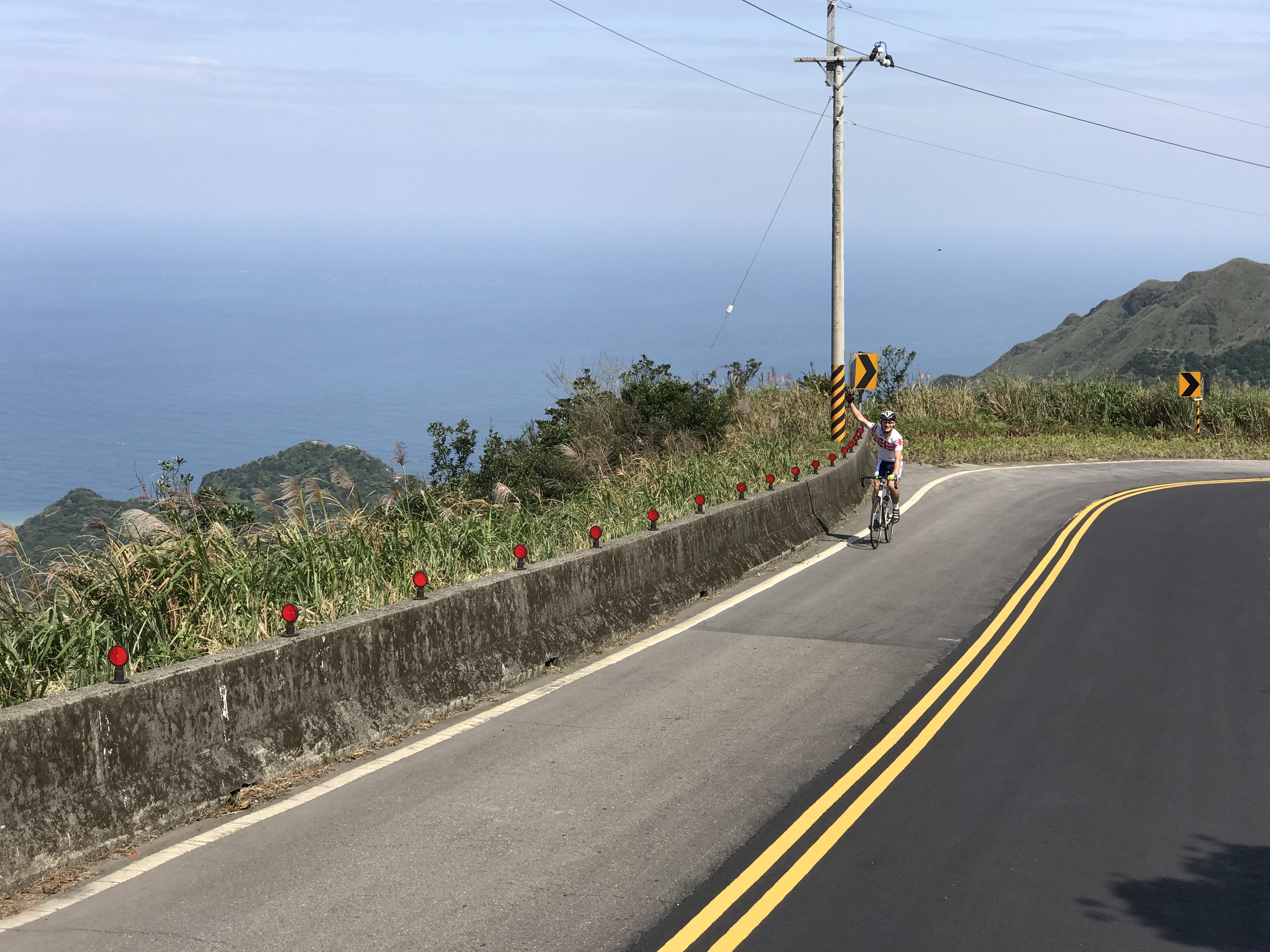 Cyclists on coastal mountain road