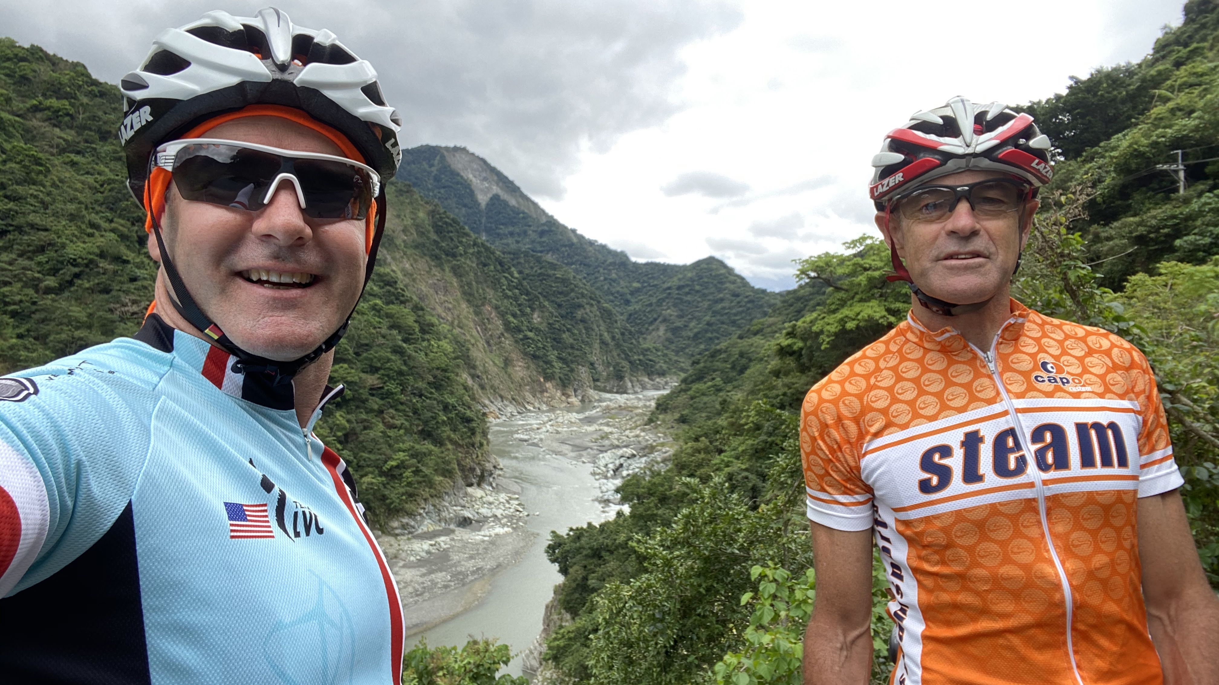 Cyclists at a mountain pass, evocative of Balkan high-country riding